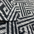 Tessuto jacquard geometrico bianco nero in maglia di viscosa/poliestere